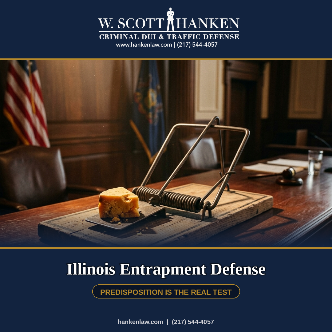 A mousetrap baited with cheese sits on a courtroom desk, symbolizing the Illinois entrapment defense discussed by attorney W. Scott Hanken.